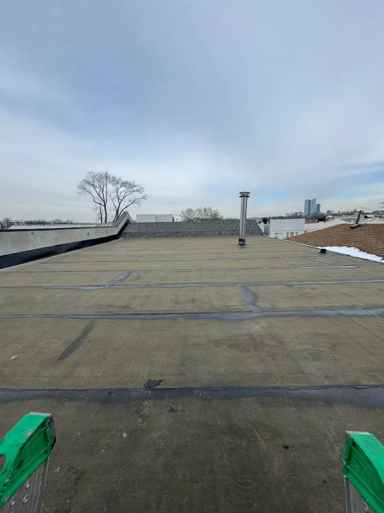 Completed flat roof membrane with parapet edges
