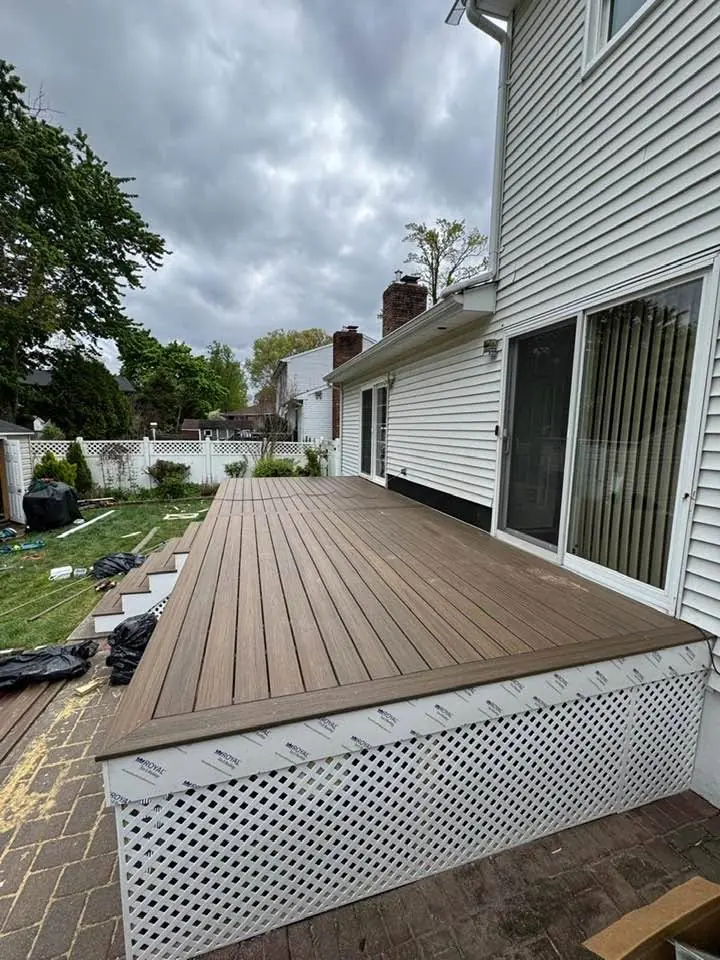 Brown composite deck with white lattice skirting