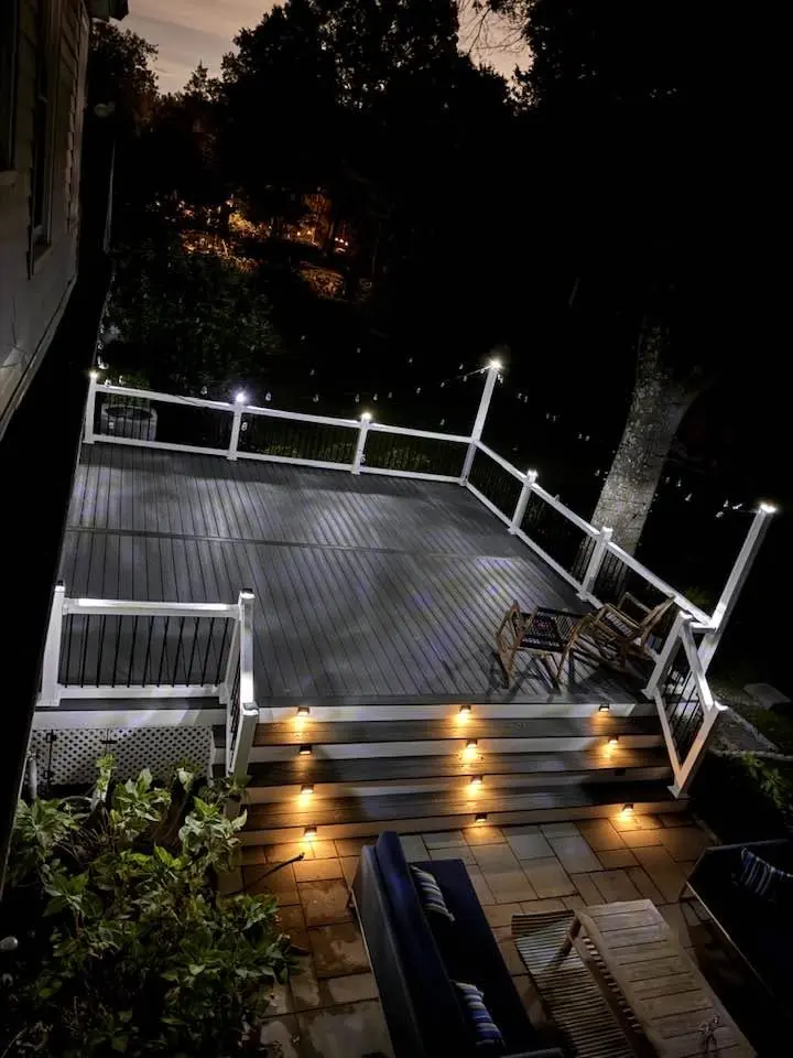 Composite deck with stair lighting at night