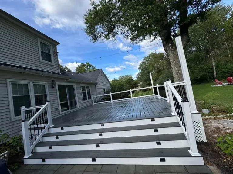 Composite deck stairs with white rails and black balusters