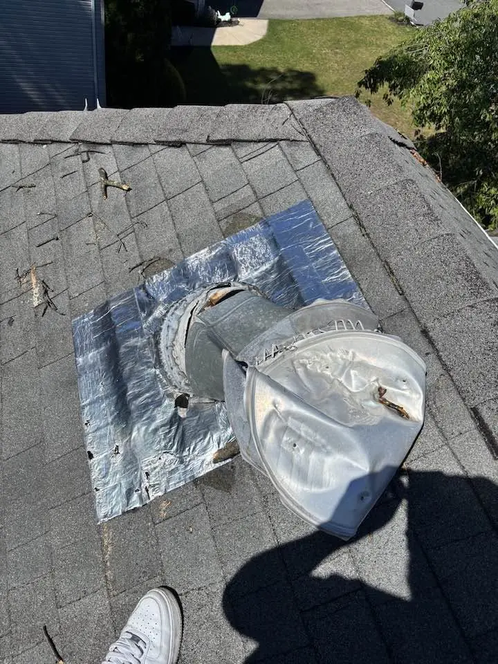 Failed roof vent with an improvised foil patch that was leaking