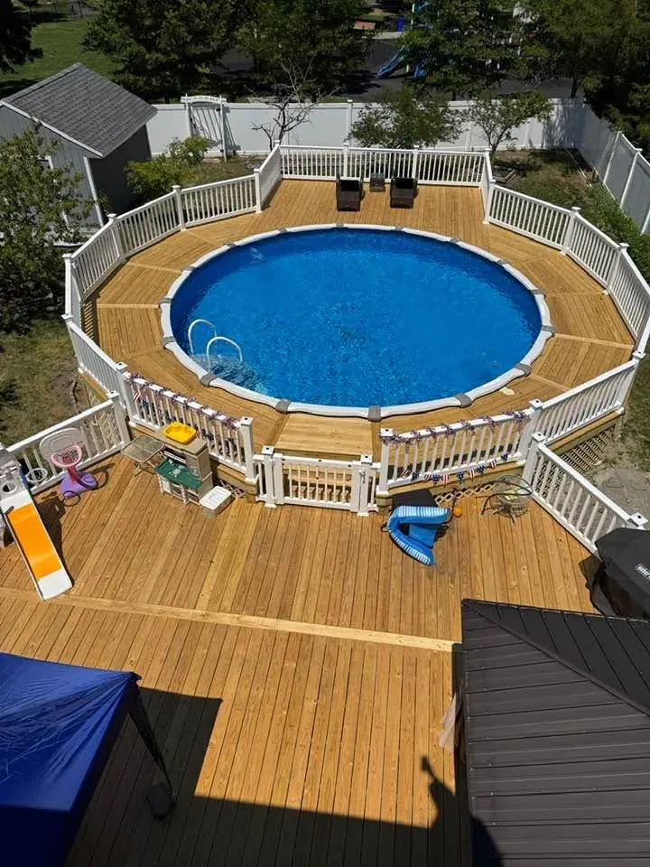 Aerial view of a pool deck joined to a lower deck