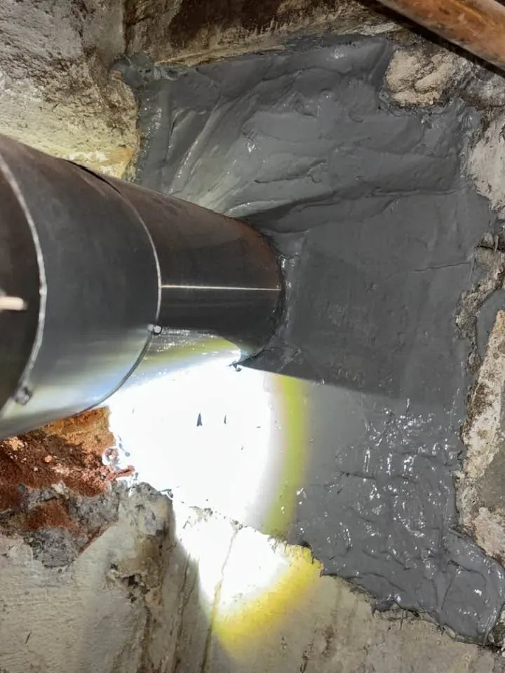 New stainless steel chimney liner connected at the thimble